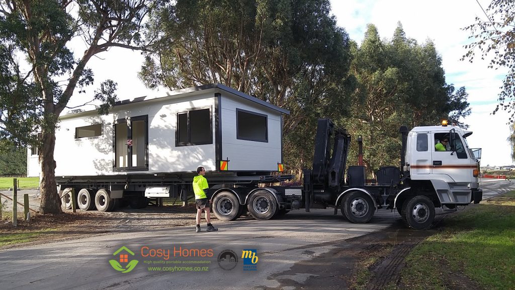 A Cosy Home being transported on a Tractor-Trailer unit