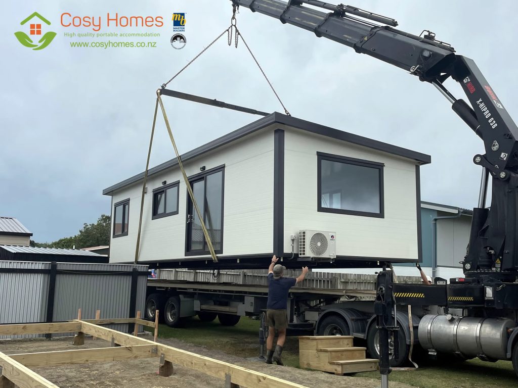 A Cosy Home being craned on to timber piles, use in high flood plain areas 