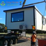 A Cosy Home being lifted by a Hiab