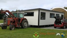 A Cosy Home being towed by a tractor